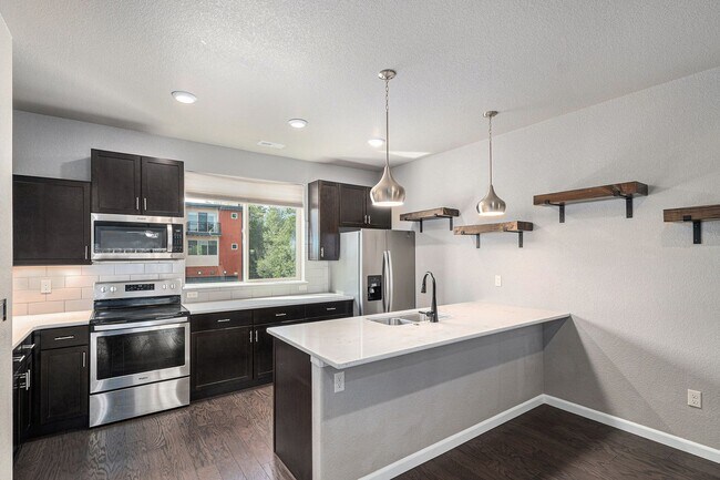 Building Photo - Creekside Townhome with Balconies on Every...