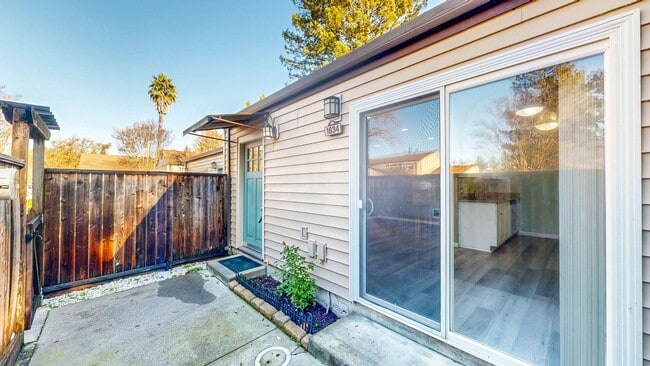 Building Photo - Cozy 1 bedroom 1 bath end unit condo with 1 car garage and private patio located next to Peterson...