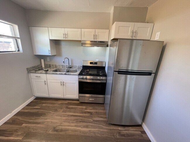 Building Photo - Remodeled Two Bedroom, End Unit with A/C and Large Fenced Yard at La Terraza!!