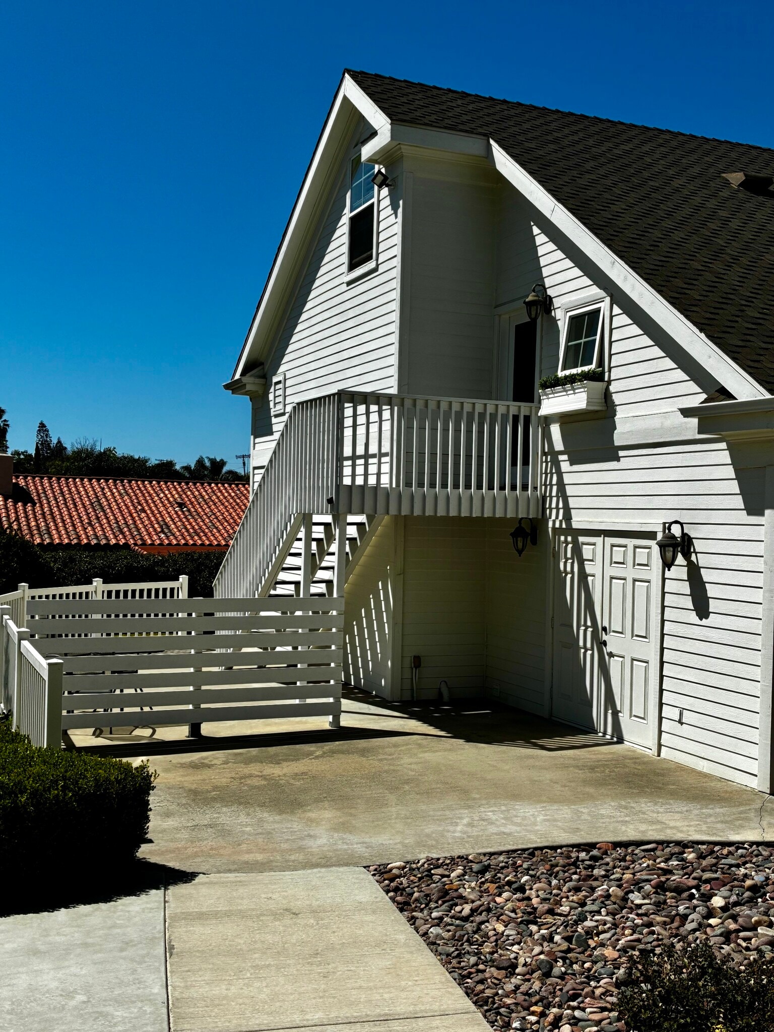 Patio, entry & access to laundry below - 649 Crest Dr