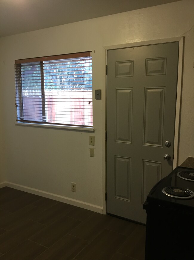 kitchen with door to back patio - 10 W Swain Rd