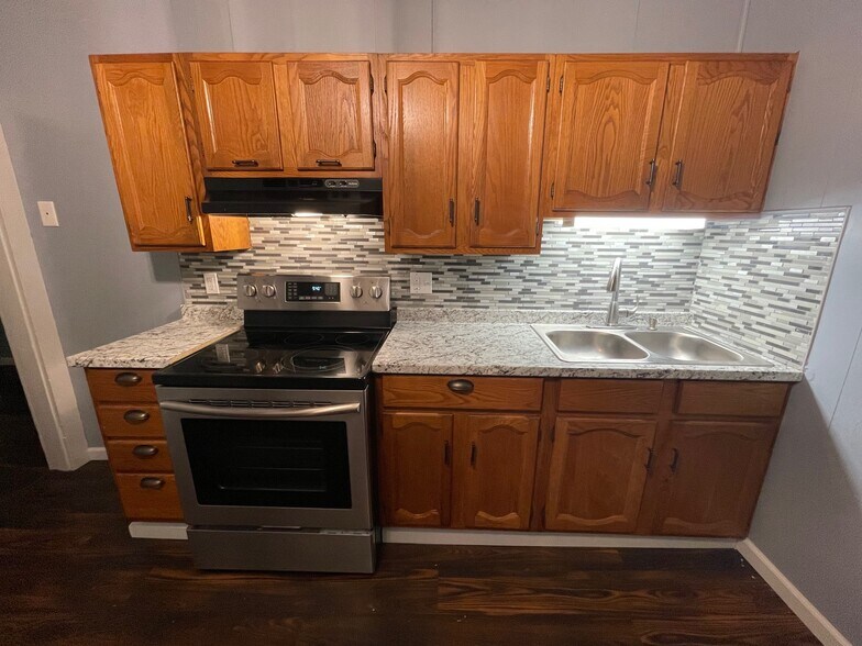 Just steps away from the parking lot, enter from a covered porch into your large eat-in kitchen. - 6 Catawba Ave