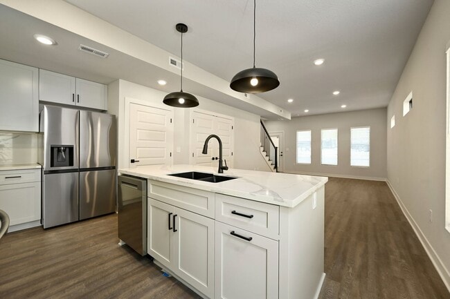 Building Photo - Three Bedroom Townhome with Attached Garage