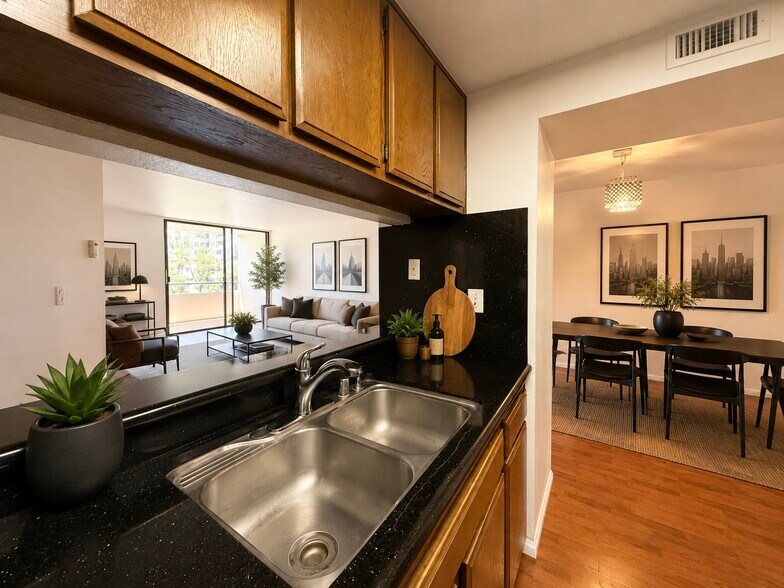 Virtually staged kitchen - 600 W 9th St