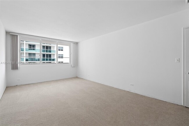 Building Photo - 5005 Collins Ave
