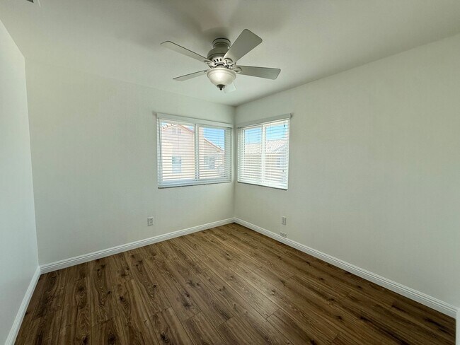 Building Photo - Corner Lot Beauty with Open Living, Guest Suite Down & Expansive Backyard