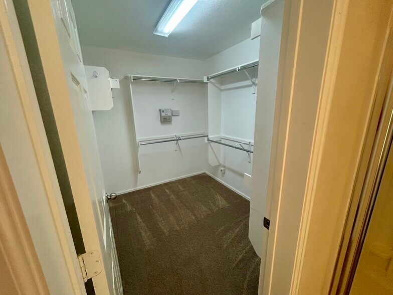 Walk in closet - primary has 2 closets; this and a regular size! - 1305 Sunflower Ln