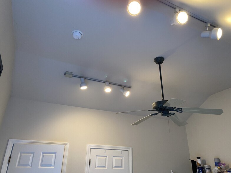 High vaulted ceiling with fan and track lighting - 11 Smith Dr