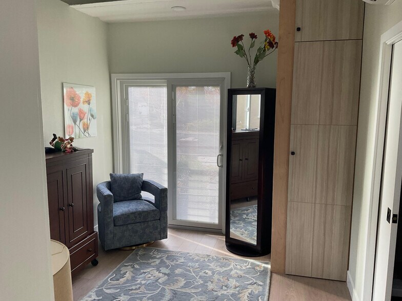 Bedroom #2 with queen-sized Murphy bed folded up - 1490 Ash St