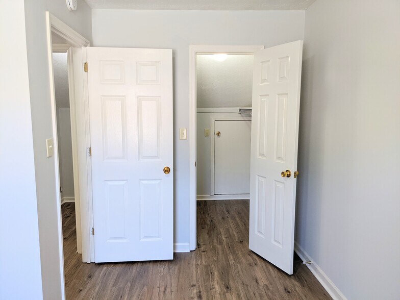 View of Left Upstairs bedroom from inside room, looking at entrance, walk-in closet - 3221 Hunters Point Dr