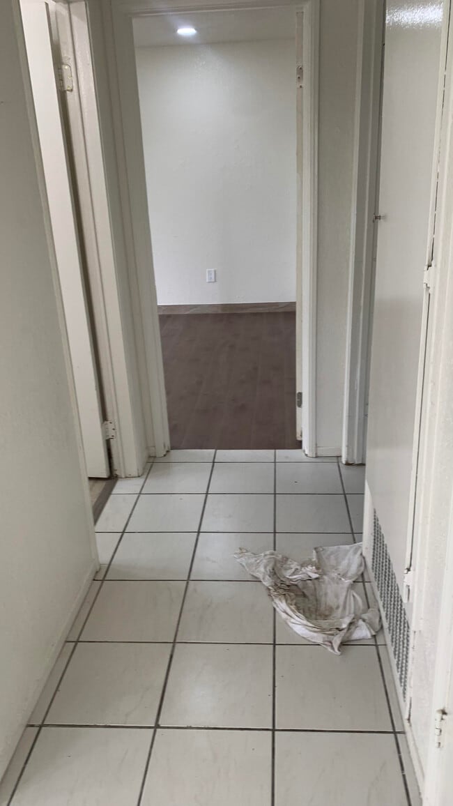 hall way to downstairs bedroom - 1649 Sheridan Cir