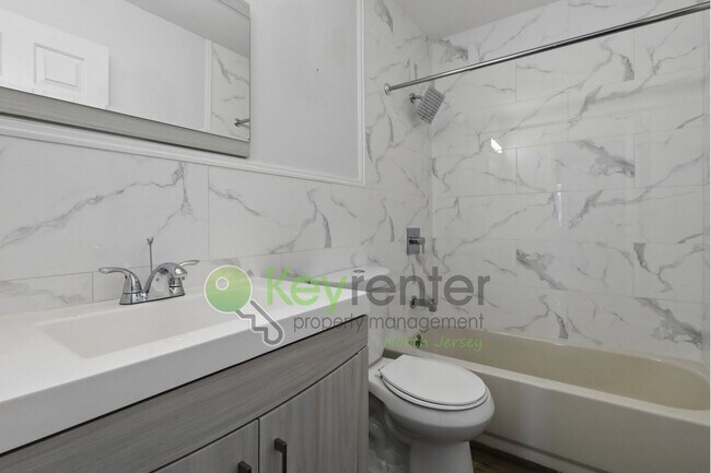 Building Photo - Spacious 2BR/2BA Duplex in Gated Community with Parking, Washer/Dryer & NYC Skyline Views