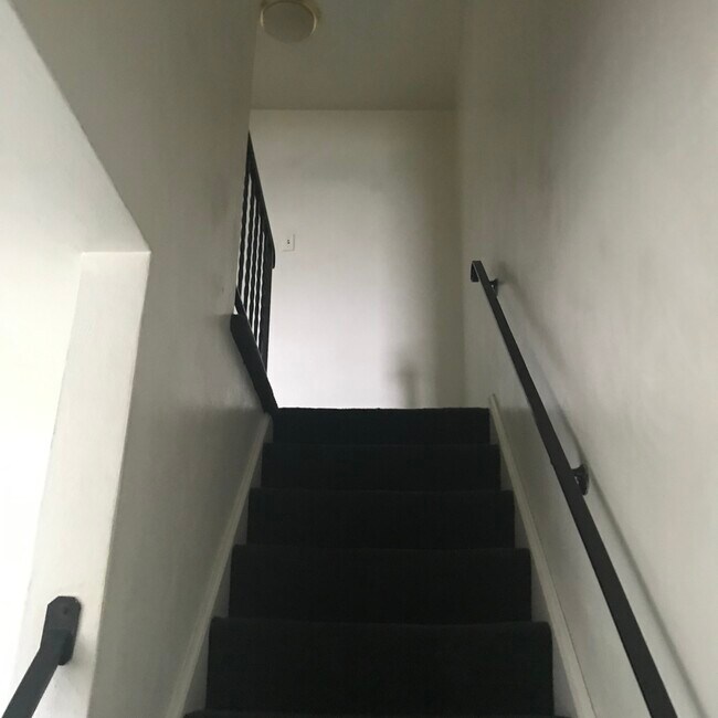 Stairs to second floor - 1443 Maple Dr