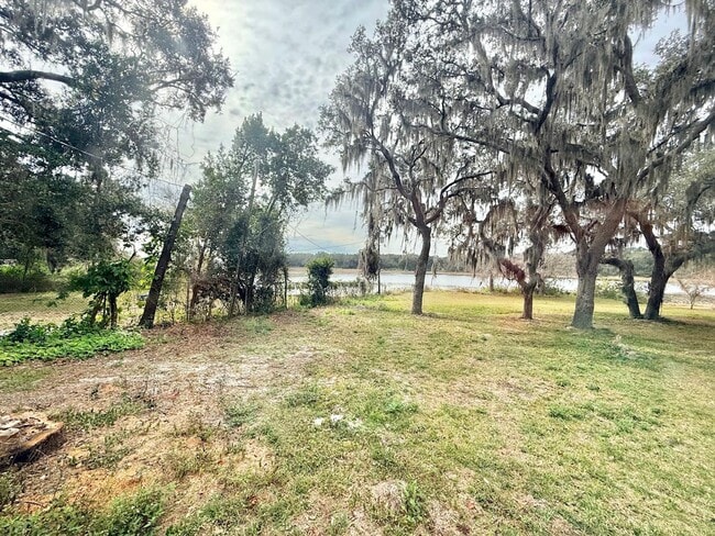 Building Photo - Enjoy the peace and quiet in this secluded home located on private lake!!!