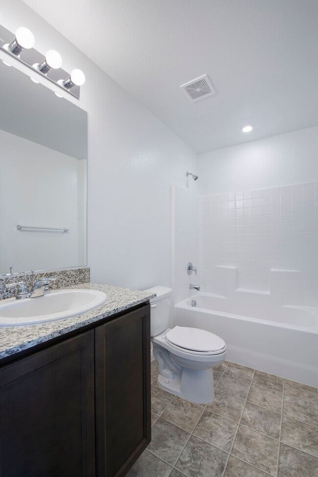Building Photo - Newer Townhome - 3 Bedrooms + 2 Car Garage - E Craig & Nellis