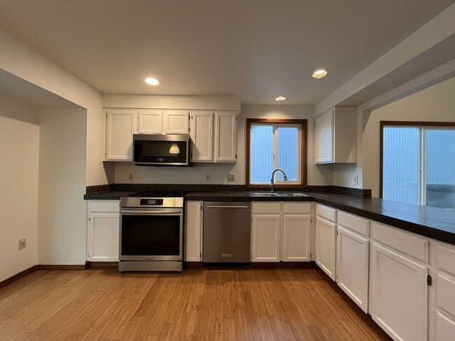 Building Photo - Spacious 3-Bedroom Home with Custom Stone Fireplace, Attached 2-Car Garage & Expansive Backyard i...