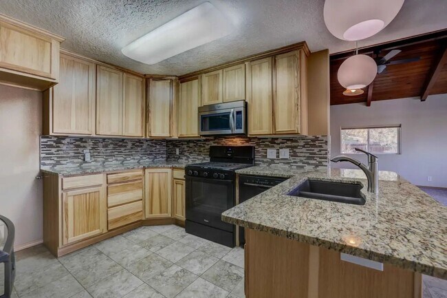 Building Photo - 1/2 acre in the with RV Hook ups