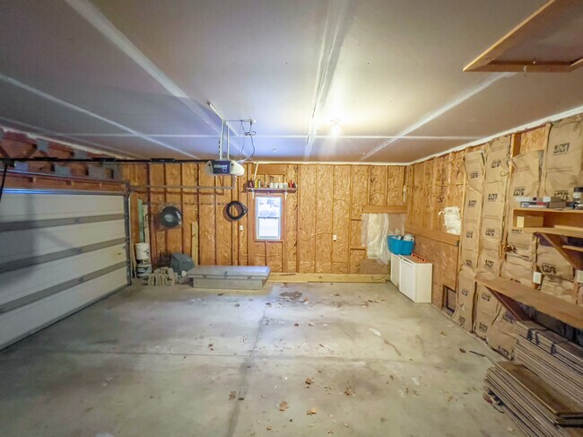 Garage has been drywalled since photos were taken. - 605 Ruxton Ridge Dr