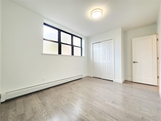 Building Photo - 76-12 Woodside Ave
