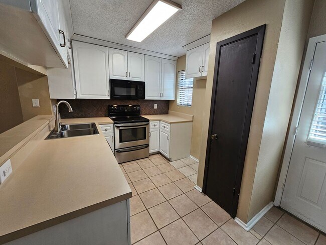 Building Photo - Stunning two-level, two-bedroom, one-and-a-half-bathroom townhome