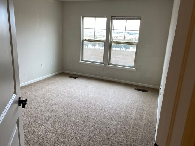 Building Photo - Large garage with attached spacious 2 bedroom townhome