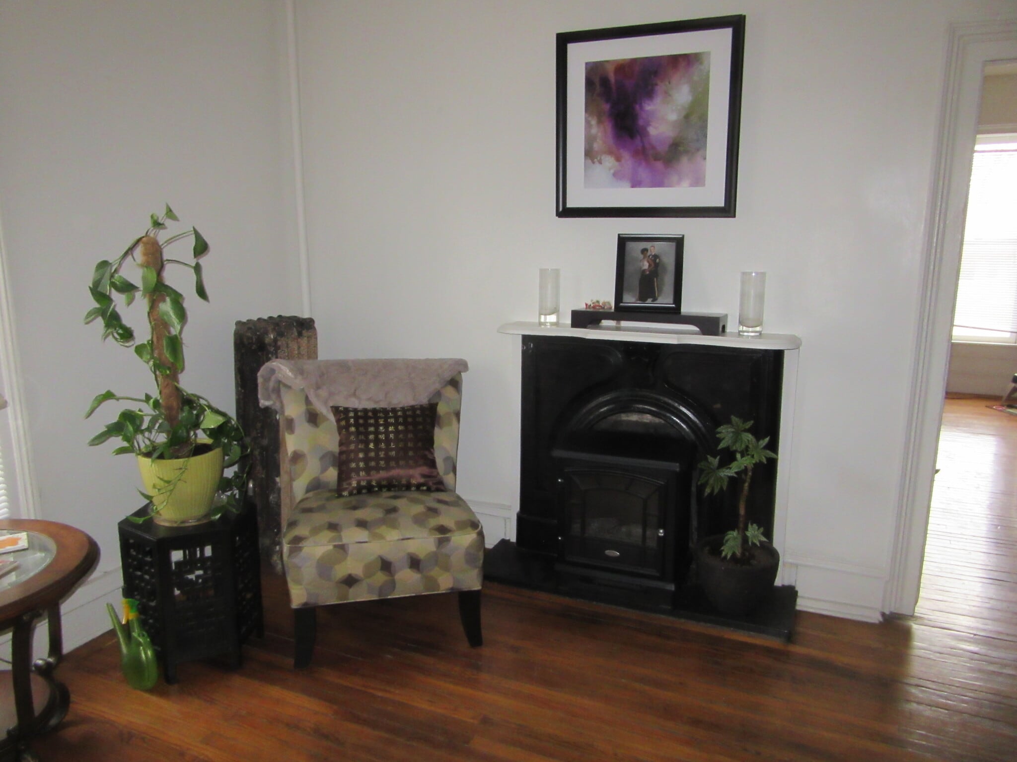 living room (original front parlor) with fireplace - 704 N Randolph St