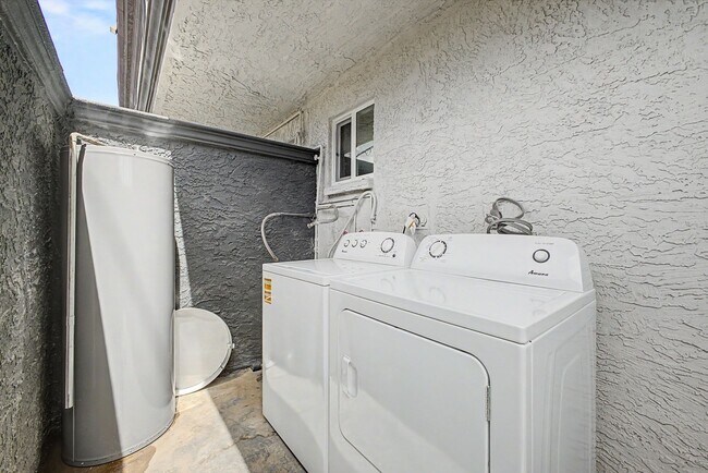 Building Photo - Spacious 2 Bed + Bonus Room | Large Private Yards | Covered Parking | 8 Weeks Free Rent!