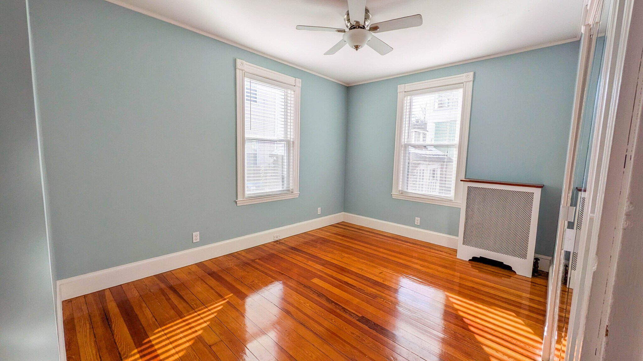 Primary bedroom with hardwood floors and ample natural light - 37 Glover Ave