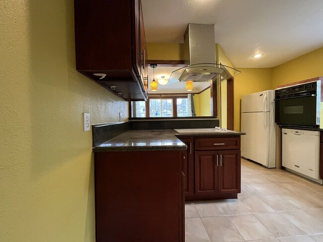 Building Photo - Classic Brick Portland Home on Stark Street with Dual Living Areas and Two Full Kitchens