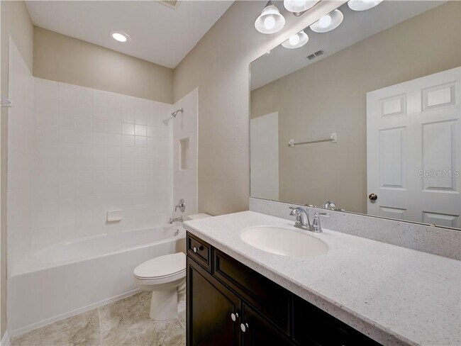 Second full bath comes with closet space and large mirror. Total 3 baths. - 1074 Amber Leaf Trail