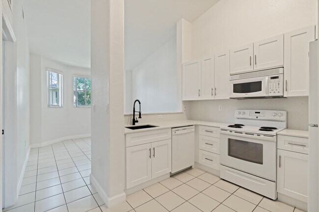 Building Photo - 2-bath condo on the 2nd floor with a newly...
