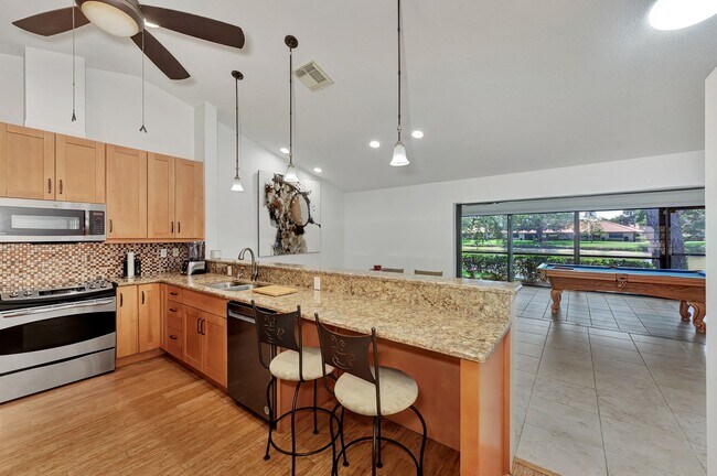 Building Photo - BEAUTIFUL 2 BEDROOM 2 BATHROOM + A DEN VILLA WITH GORGEOUS LAKE VIEWS!