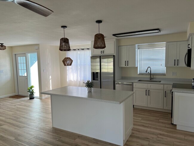 Kitchen island open to great room - 5255 Tower Dr