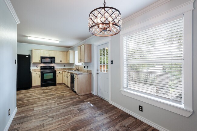 Building Photo - Modern Elegance: 3-Bedroom Townhome with Wood Flooring, Shaded Deck, and Inclusive Amenities