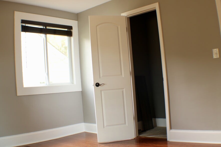 Closet in bedroom with vinyl plank flooring - 311 Paris Mountain Ave