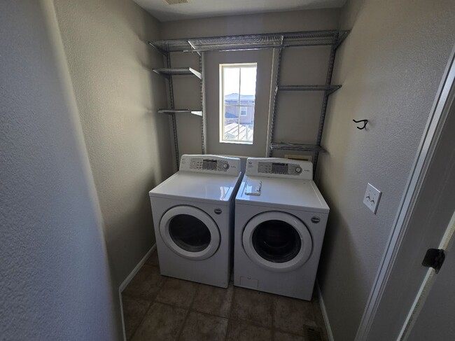 Upstairs Laundry Room - 11105 Woodhurst Cir