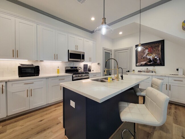 Building Photo - This 4-bedroom, 3-bathroom, two-story residence comes with a generous two-car attached garage. Re...