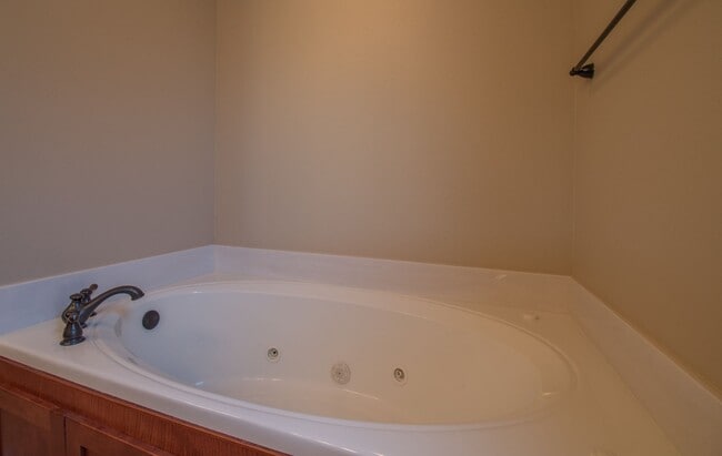 Building Photo - Luxurious Executive Row House in Northeast Fayetteville! Lawn care included!