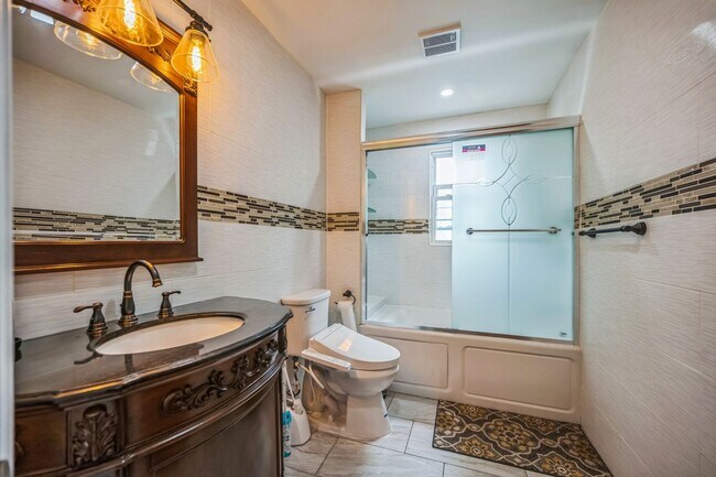Building Photo - Experience Modern Luxury: Fully Renovated ...