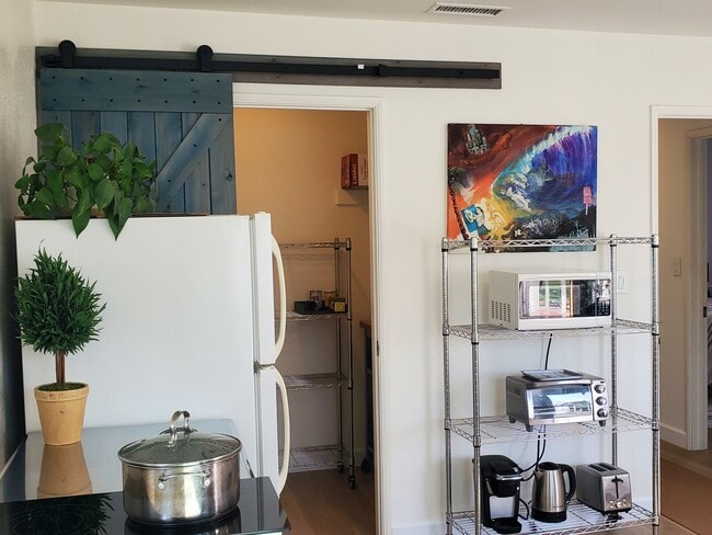 Full size fridge, pantry, 2-burner stove, other kitchen appliances - 301 N Francisca Ave