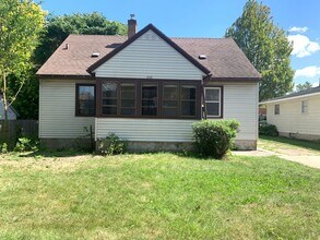 Building Photo - Three bedroom home with beautiful hardwood floors and central air!