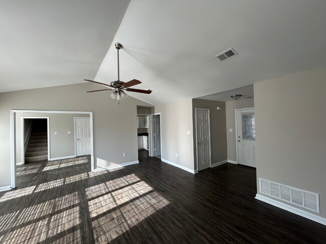 Building Photo - Spacious 4BR/2BA Olive Branch Home | 1,965 Sq Ft, Modern Fireplace, Bay Window & 2-Car Garage