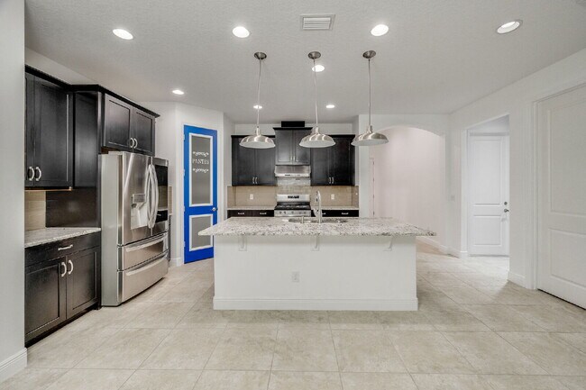 Building Photo - 4BR, 2.5BA home with resort style outdoor living!