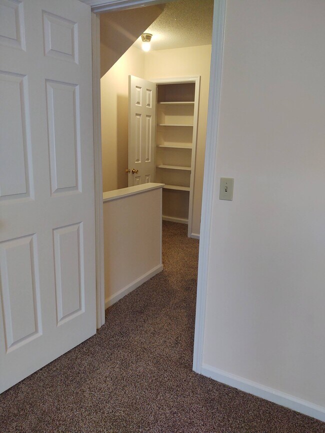View to linen closet & atrium from front bedroom. - 251 Knight Dr