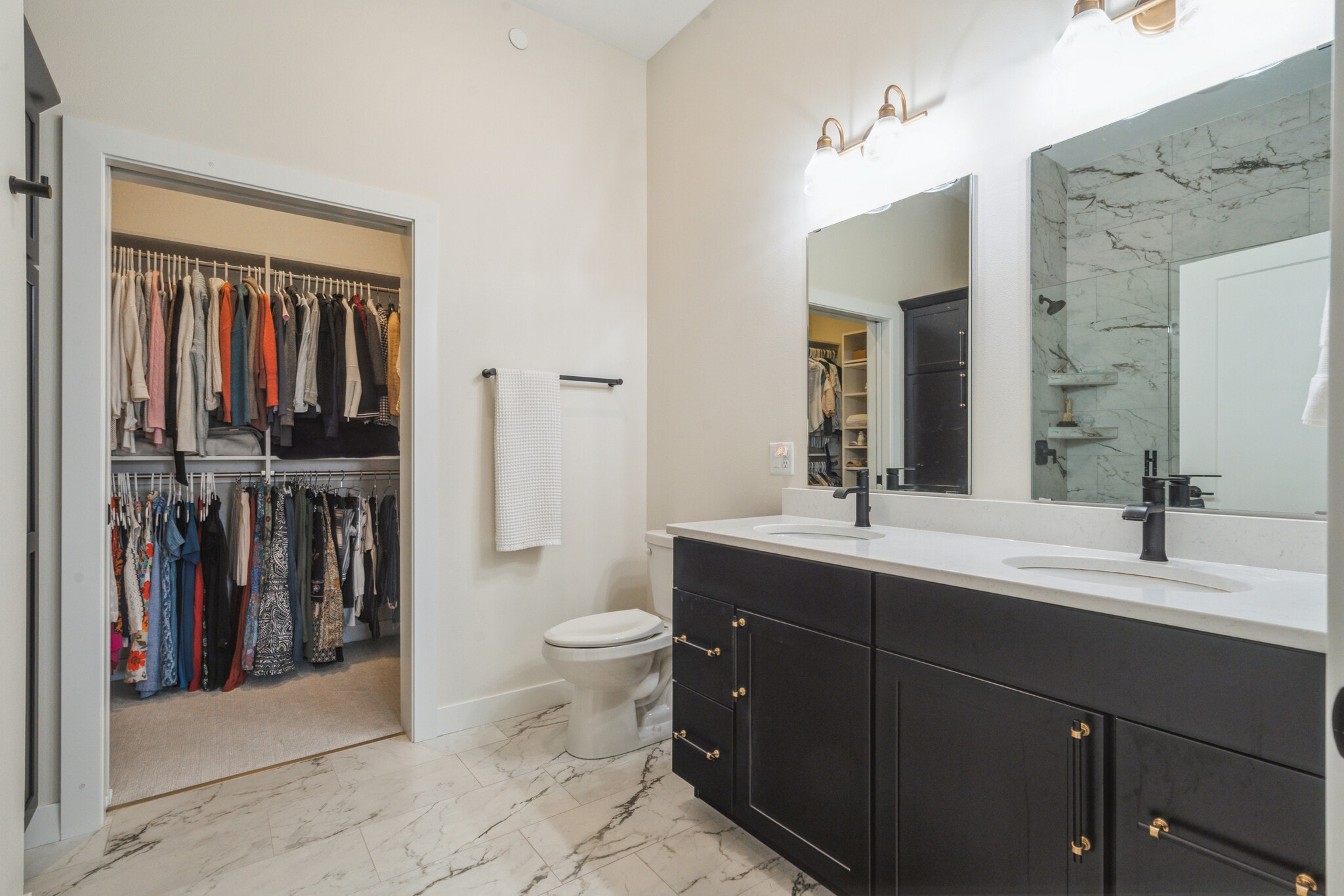 Bathroom with two sinks, floor to ceiling tiled shower and large walk-in closet - 1953 1st Ave SE