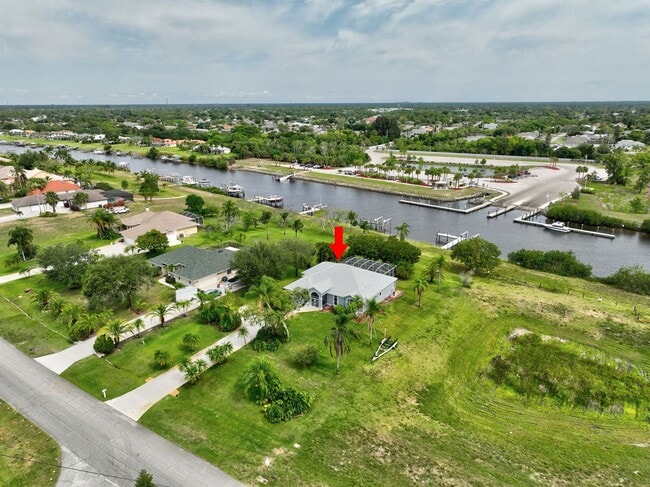 Building Photo - A BOATER'S PARADISE WITH THIS STUNNING 3 BEDROOM, 2 BATH WATERFRONT POOL HOME W/DOCK & BOAT LIFT ...
