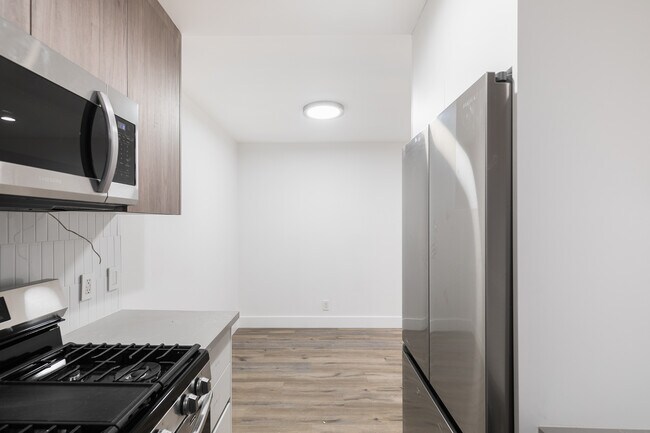 Building Photo - Experience Modern Living: Newly Renovated ...