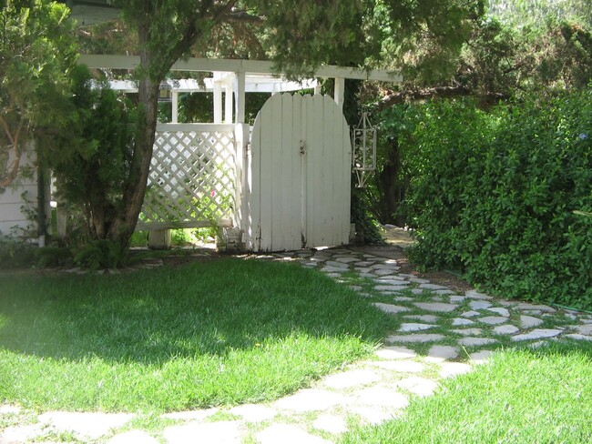 entrance into an arbor - 6129 Andalusia Ave