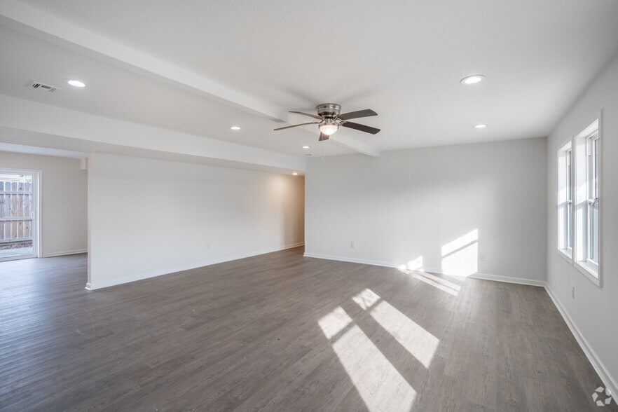 3BR, 2BA - 1,320SF - Living Room - Orleans Apartments