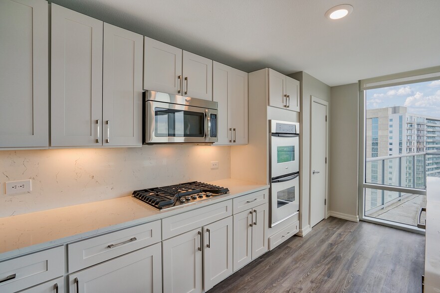 Penthouse kitchens are complete with high-end appliances and quartz countertops - The Monarch by Windsor